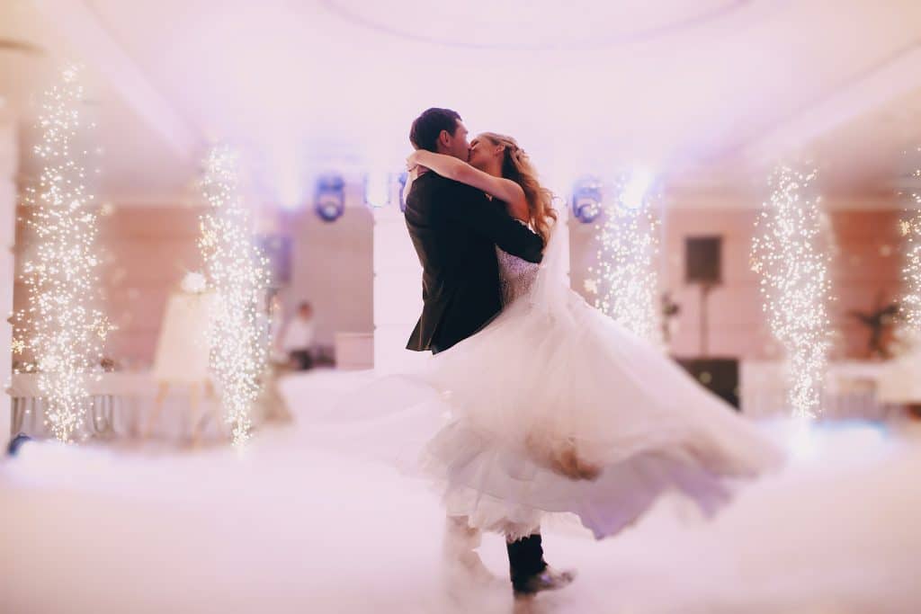 A couple's first dance with cold spark fountains